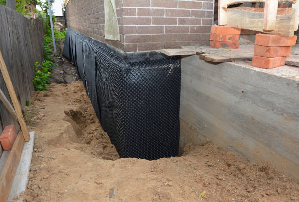 Happy homeowners after waterproofing job in Bayville